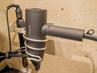 Hairdryer and straightener neatly organized on a wall mount at Bayside Villa Miyako Iland.