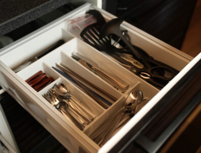 Organized kitchen drawer with cutlery, chopsticks, and cooking utensils at Enishiya Izumo.