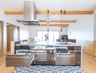 Spacious open kitchen with island counter, equipped with modern appliances and storage drawers at Ocean Villa Naruto.