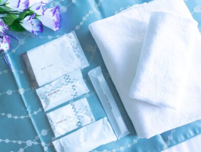 Complimentary amenities at Ocean Villa Naruto, including towels, hairbrush, toothbrush, and other toiletries.