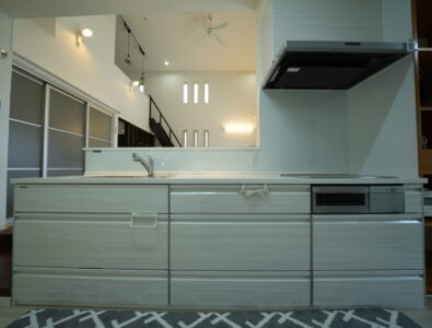 Modern kitchen with a built-in stovetop and sleek cabinetry at Ocean Villa Tokunoshima.
